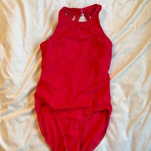Women’s Red high neck and open detailed back leotard.